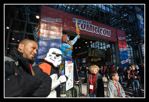 Christopher Burrill, 22, a comics and Star Wars fan, poses beside a Sandtrooper at the entrance of the New York Comic Con.
